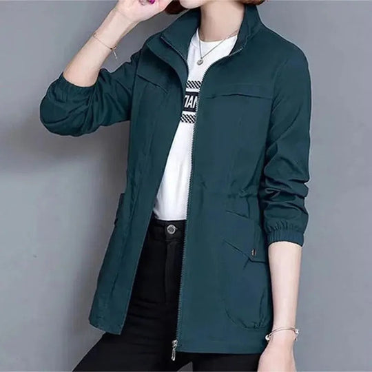 Fashionable women's long trench coat, lightweight and water-repellent, designed for elegant spring outerwear.