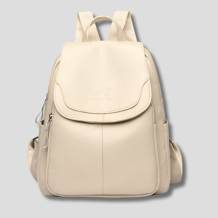 Close-up of embossed leather anti-theft backpack. Premium ladies' bag, perfect for daily style & security.
