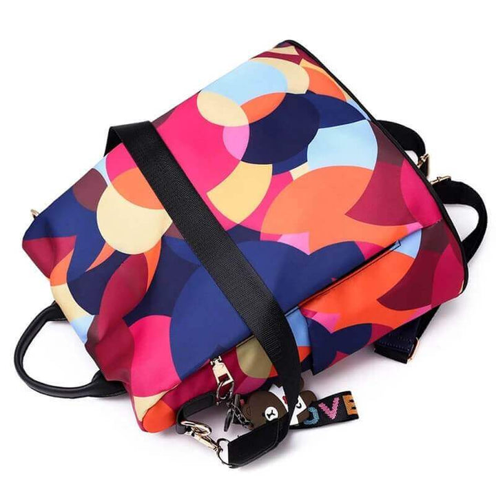 SafeHold anti-theft women's backpack, water-resistant. Features many compartments for secure, organized storage.