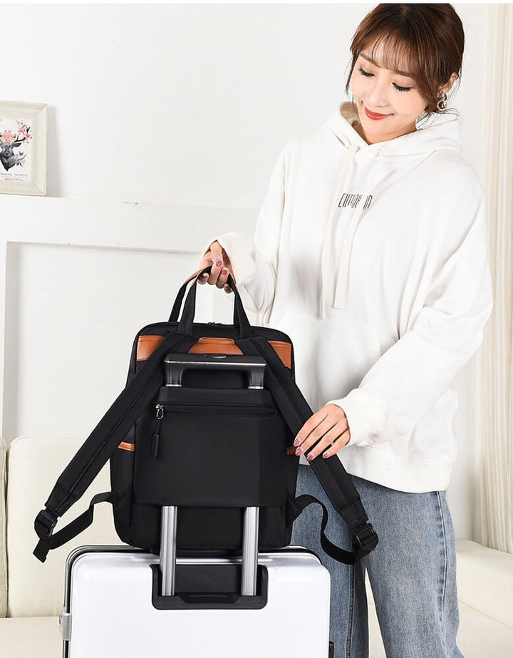 Versatile women's anti-theft travel backpack. Water-resistant Oxford design, ideal for school, commute, & travel.