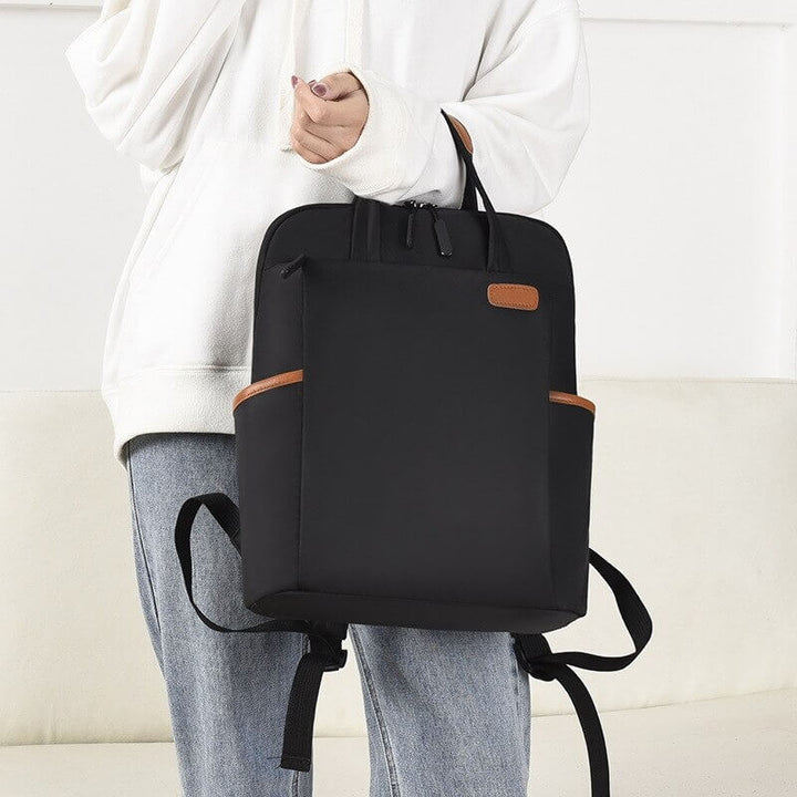 Durable water-resistant anti-theft backpack for women. Lightweight Oxford fabric, perfect travel & daily organizer.
