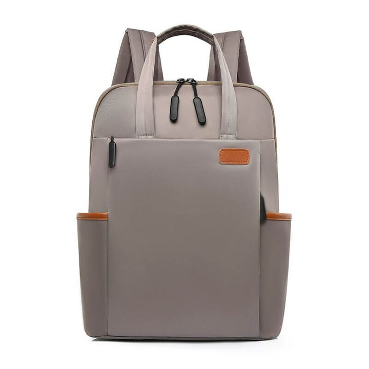 Pink women's anti-theft travel backpack. Fashionable, water-resistant, & secure for daily travel essentials.