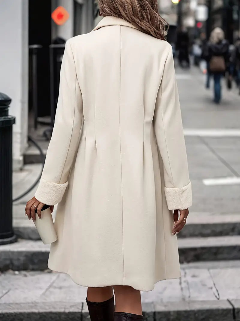 Elegant women's midi-length apricot trench coat, a sophisticated double-breasted outerwear piece with notched lapel.