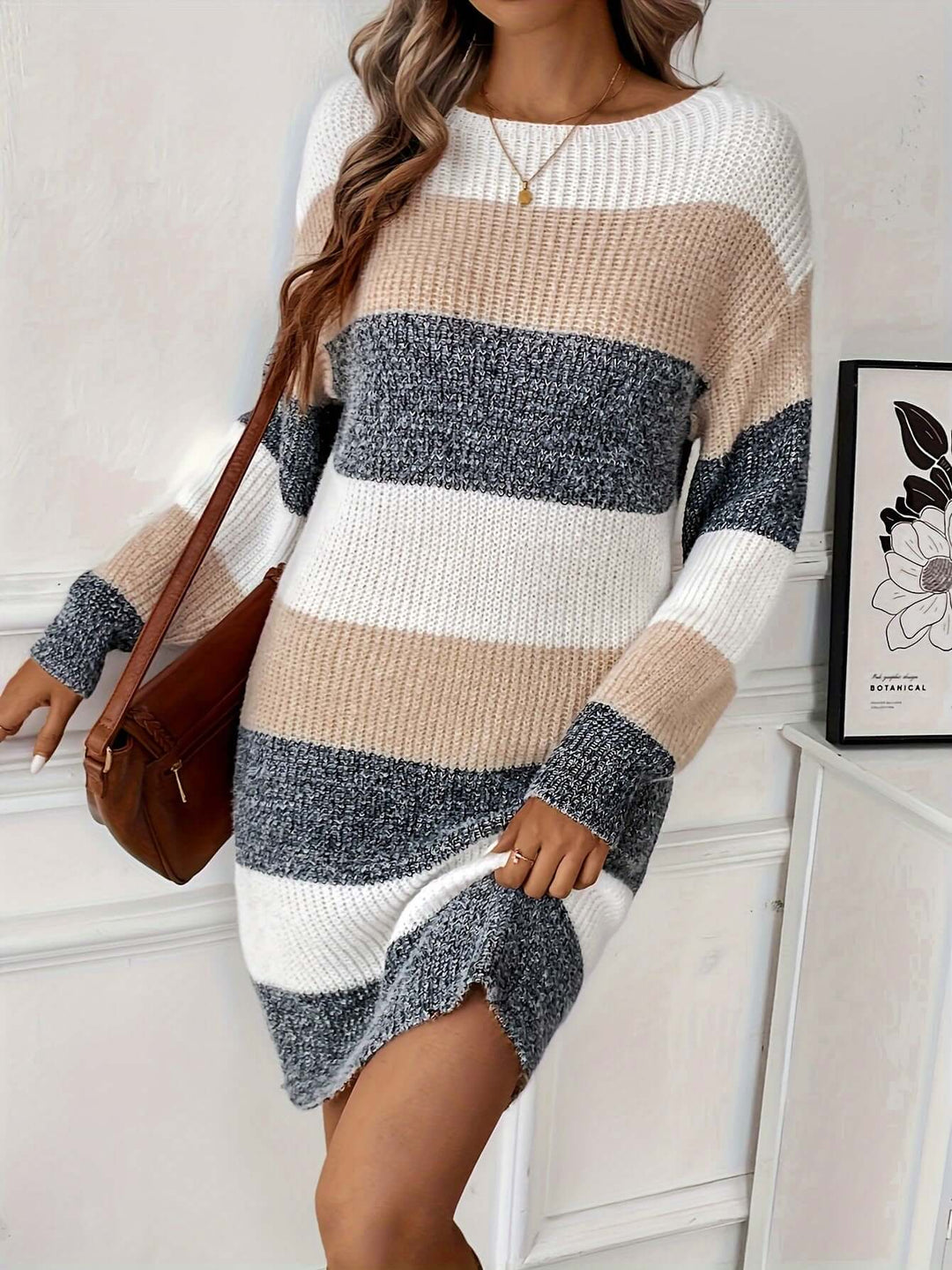 Cozy knitted women's sweater dress with stylish apricot stripes, ideal for fall fashion.