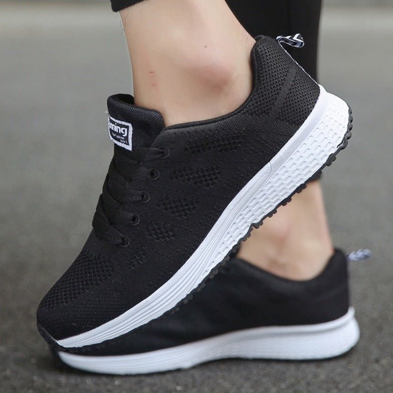 Women's Arch Support Sneakers from a top-down view, showcasing their ergonomic design