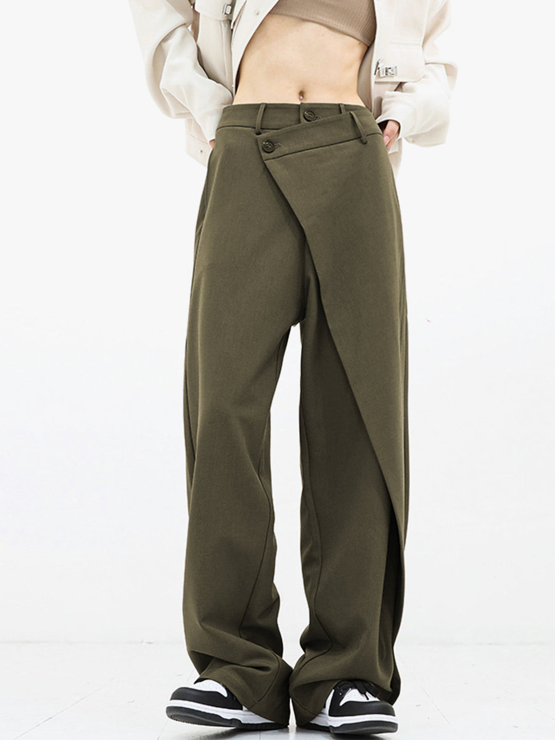 Unique women's asymmetrical fashion trousers, relaxed fit, creating a distinctive modern wardrobe statement.