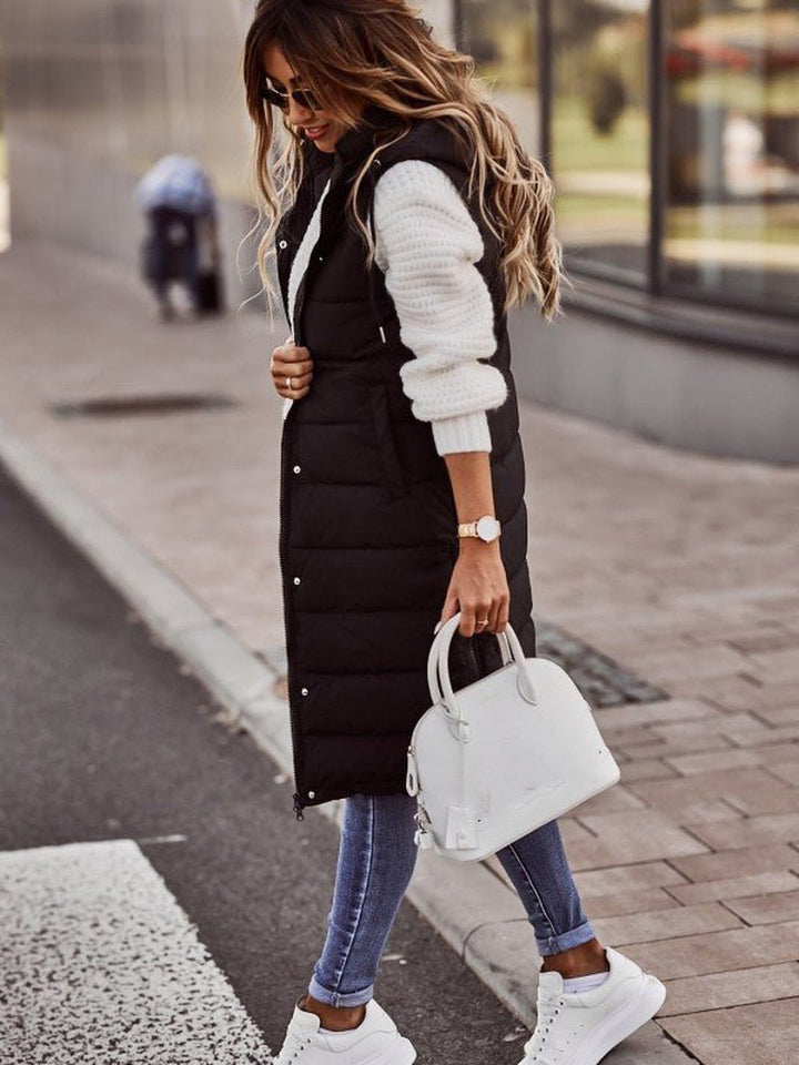 Chic Aurora women's knee-length quilted vest, perfect outerwear for fall fashion and winter layering comfort.