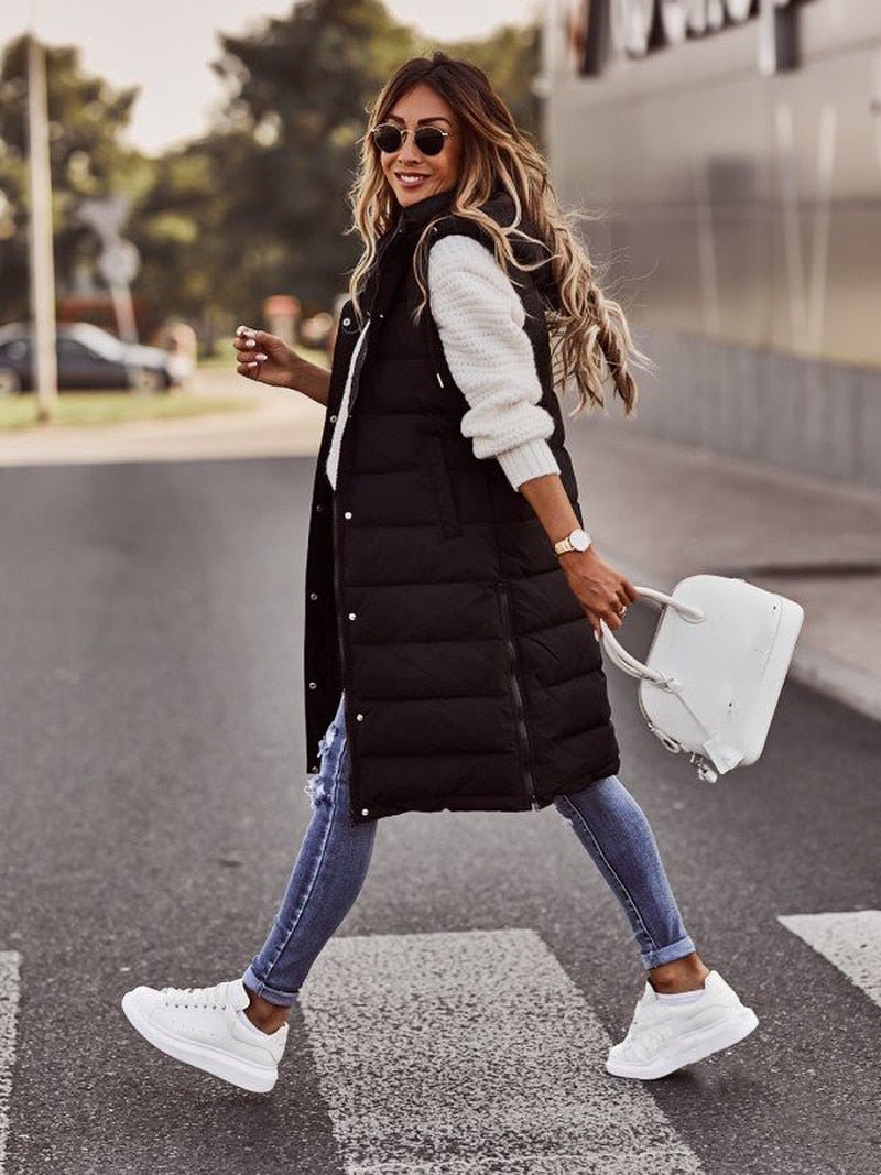 Comfortable Aurora hooded knee-length quilted bodywarmer vest for women, ideal casual fall & winter style.