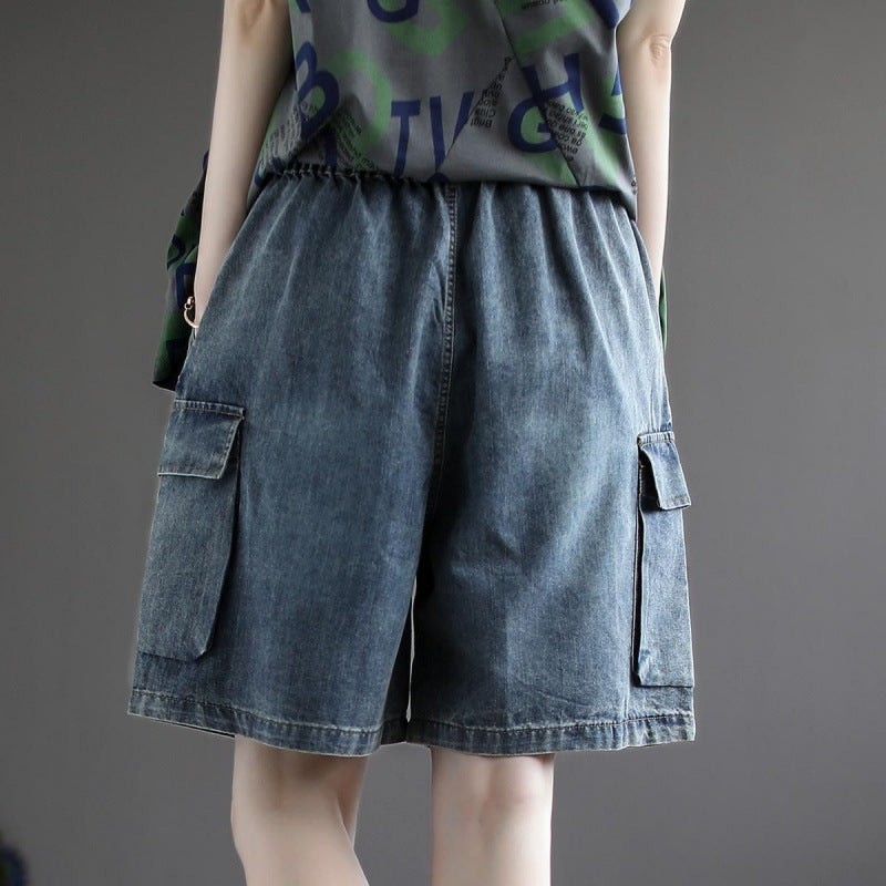 Model wears women's black baggy cargo jorts, perfect for casual everyday wear or summer streetwear fashion.