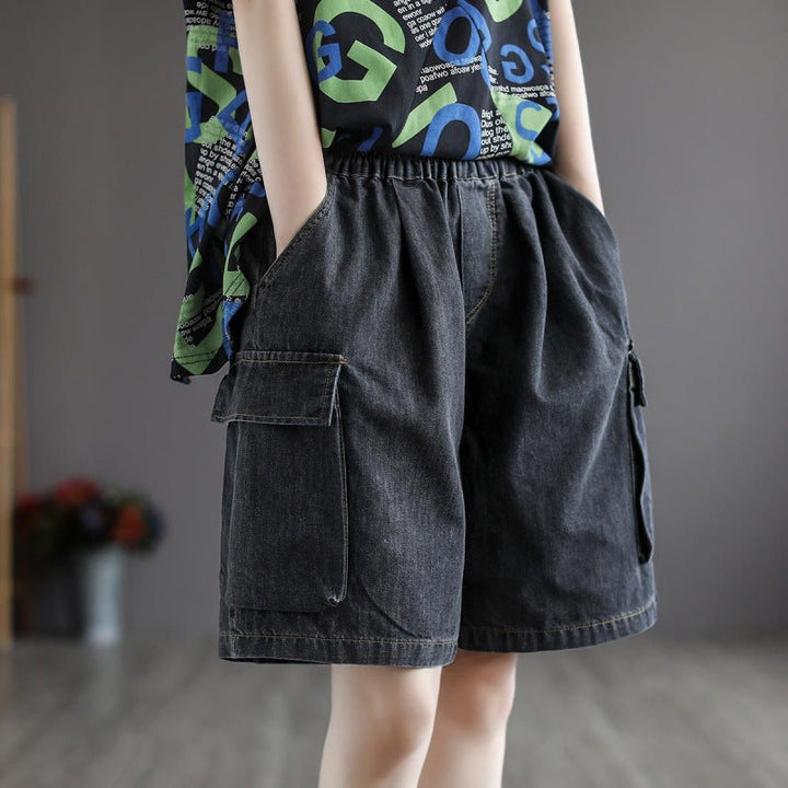 Close-up of women's wide leg denim cargo jorts with prominent utility pockets, ideal for a relaxed summer outfit.