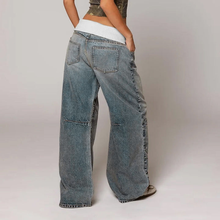 Trendy women's wide leg jeans, featuring a relaxed, baggy fit and vintage wash for a chic casual look.