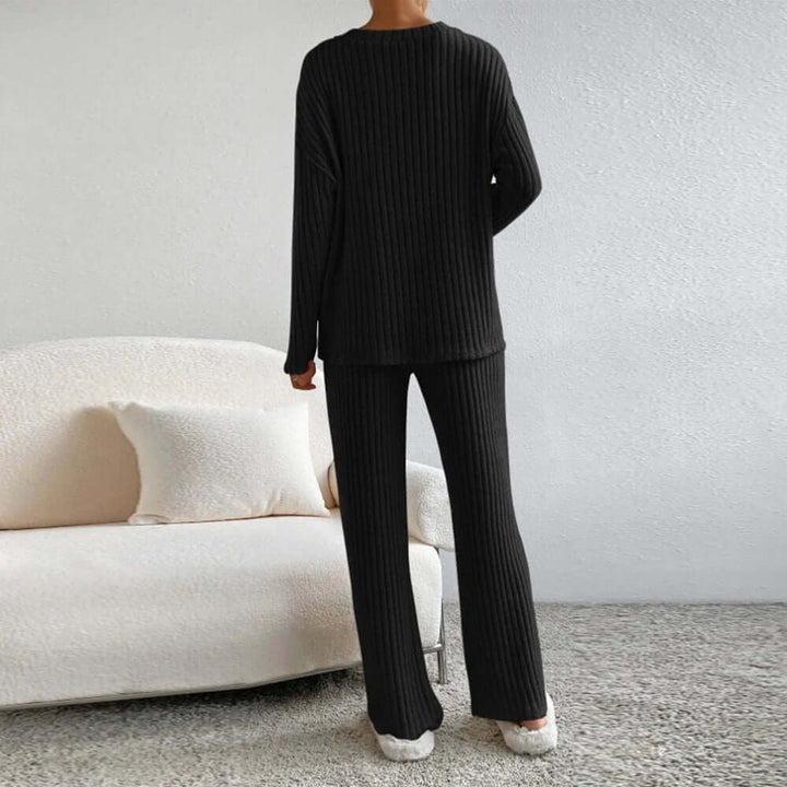 Stylish women's white knit lounge set, featuring a relaxed fit. Perfect comfortable two-piece for casual wear.