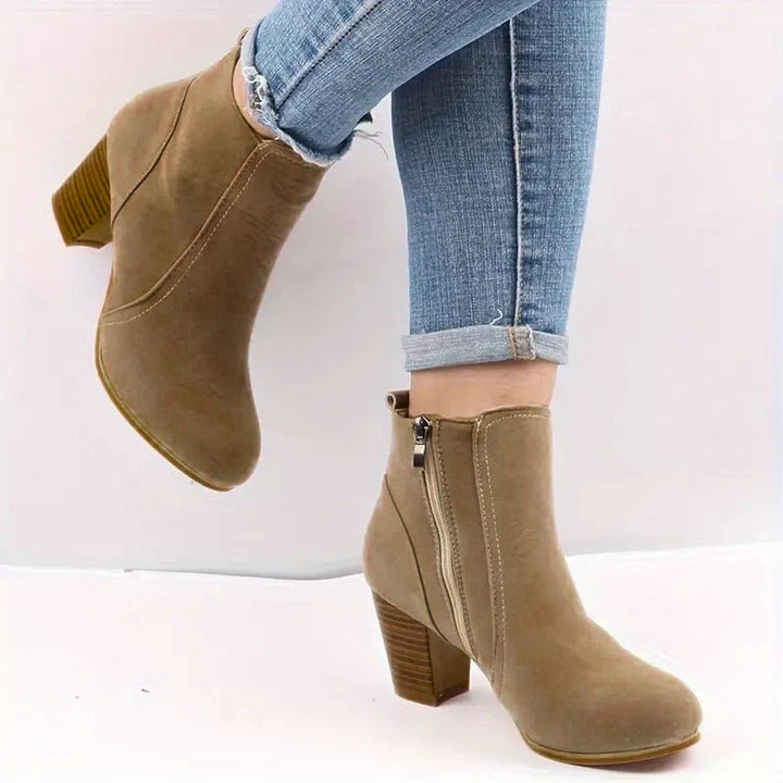 Versatile women's block heel ankle boots with convenient side zip, ideal for everyday and dress wear.