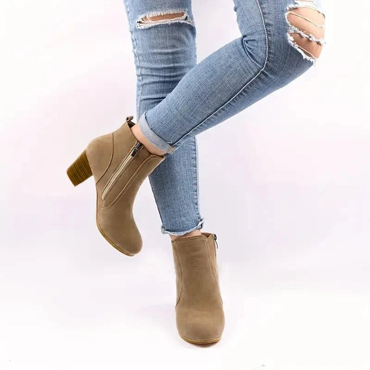 Chic women's block heel ankle boots, featuring a practical side zip and comfortable design for all-day wear.