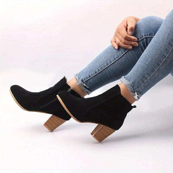Everyday women's block heel ankle boots with side zip, blending comfort with modern fall fashion.
