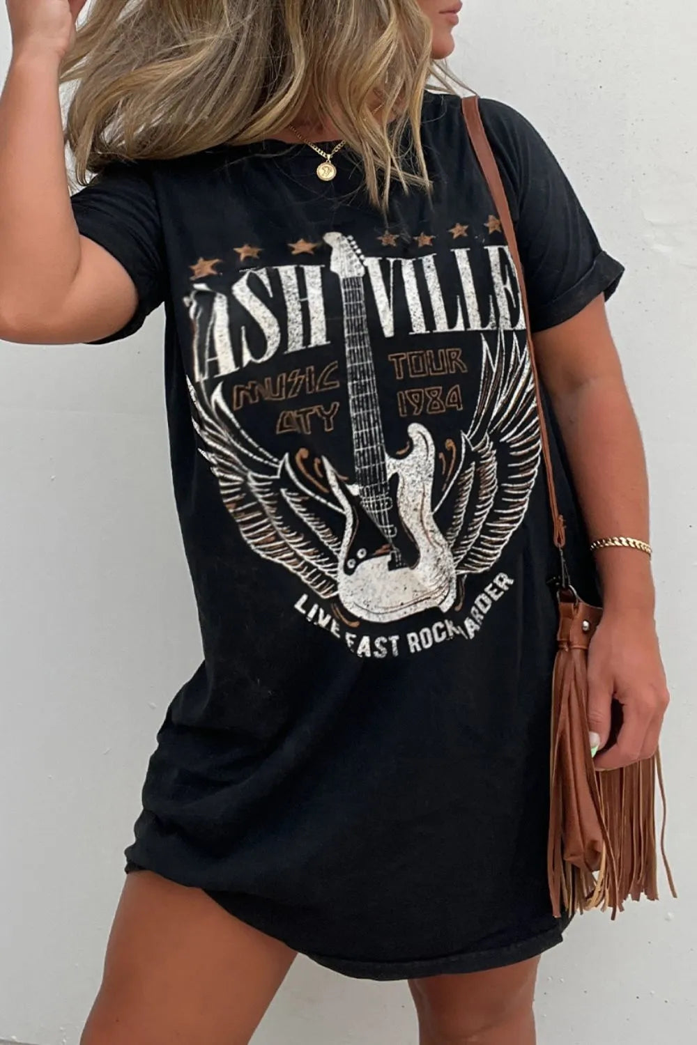Stylish women's black graphic tee dress; mini, short sleeve, relaxed fit for an edgy statement & versatile everyday wear.