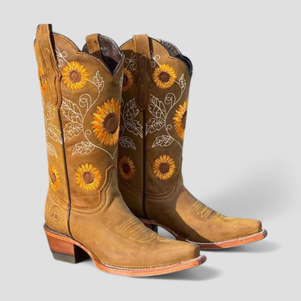 Modern women's tall embroidered cowgirl boots with low block heel, ideal for a stylish western look.