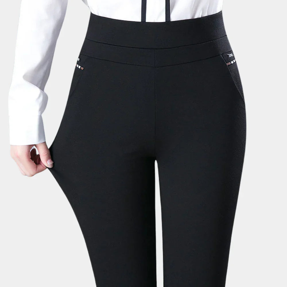 Versatile women's black stretch trousers, perfect for office or casual outfits. Comfortable high-waisted design with elastic waistband.