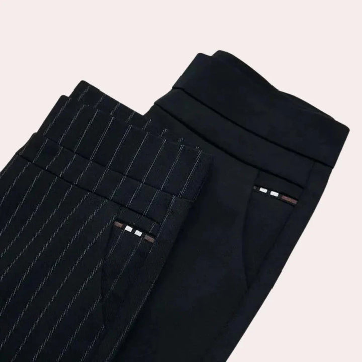 Close-up of comfortable women's high-waisted stretch trousers in black, highlighting the soft fabric and elastic waist details.