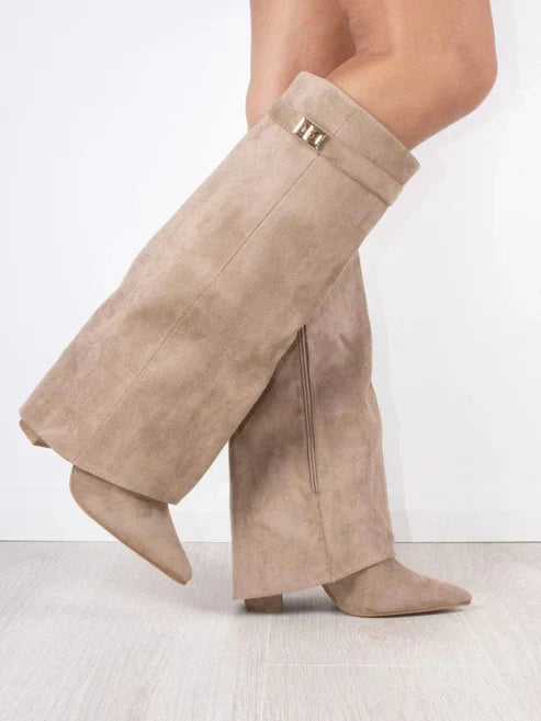 Women's black knee-high flap boots with block heel, pointed toe, and side zipper for elegant winter fashion.