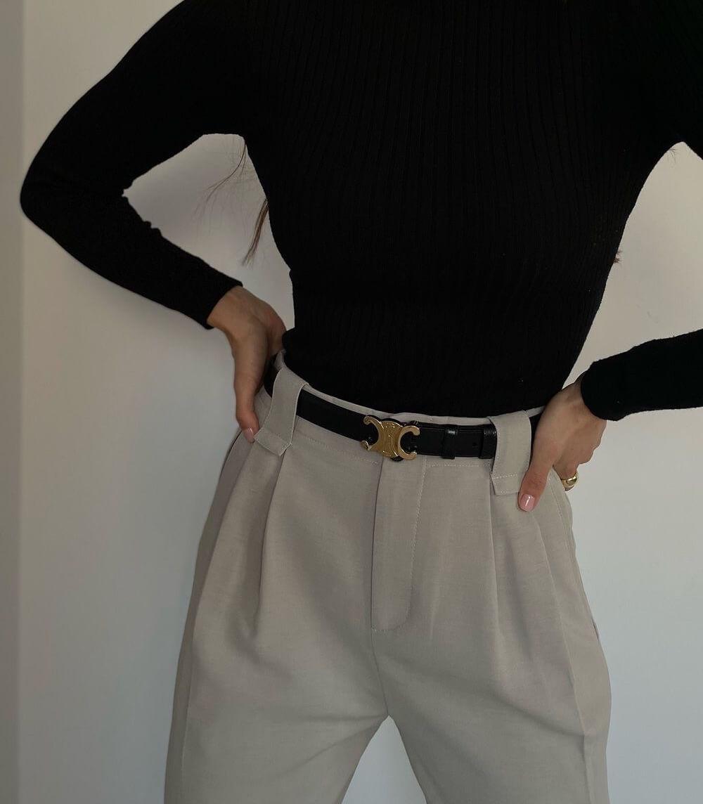 Elegant brown leather women's belt with a gleaming gold buckle, a versatile fashion accessory.