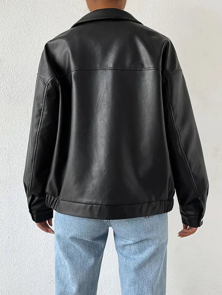 Black women's moto style jacket featuring a full zip and stand collar. Versatile edgy fashion outerwear.