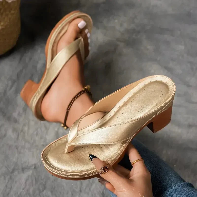 Comfortable women's black low heel sandals, perfect for casual wear with cushioned support.