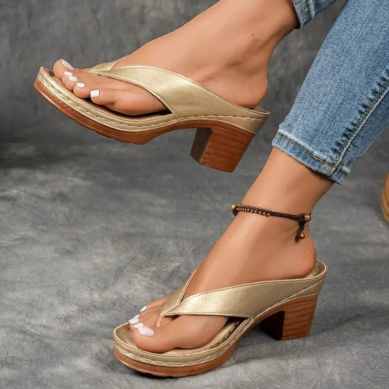 Stylish black orthopedic sandals for women featuring a low heel and excellent arch support.