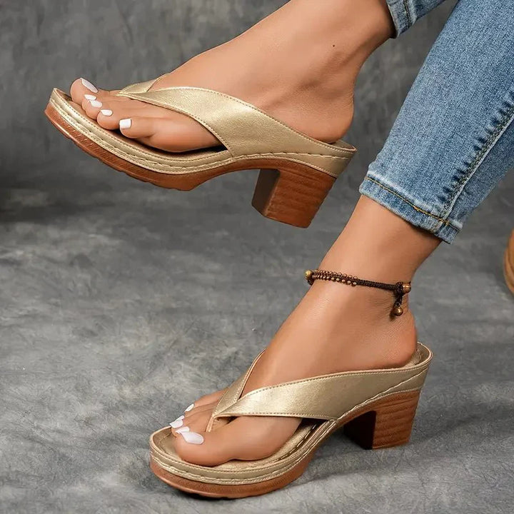 Stylish black orthopedic sandals for women featuring a low heel and excellent arch support.