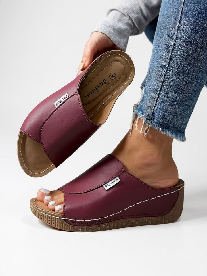 Modern black platform sandals for women, offering both comfort and chic style.