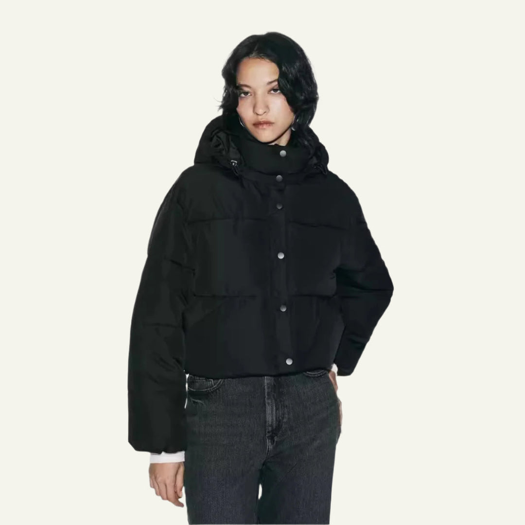 Women's black puffer jacket, lightweight and warm, perfect for winter cold weather. Stylish insulated outerwear.