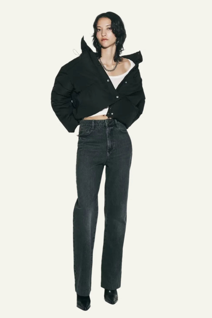 Stylish women's black puffer jacket, a warm winter coat designed for fashion and cold weather protection.