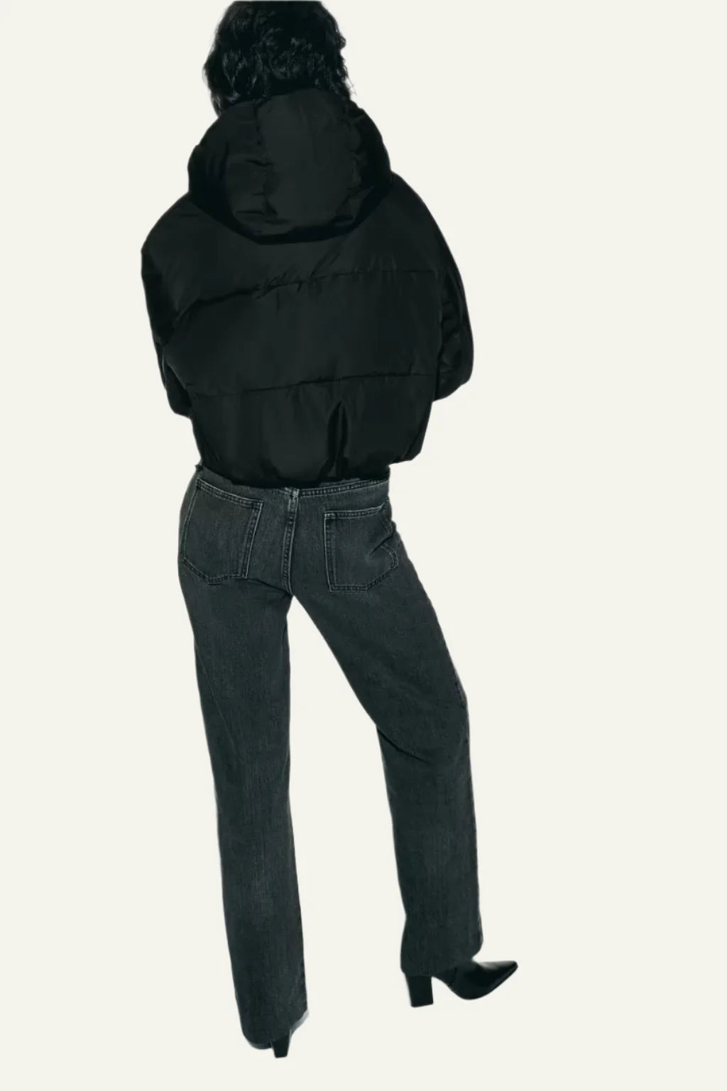 Everyday women's black puffer jacket, offering lightweight warmth and insulation for a cold winter.