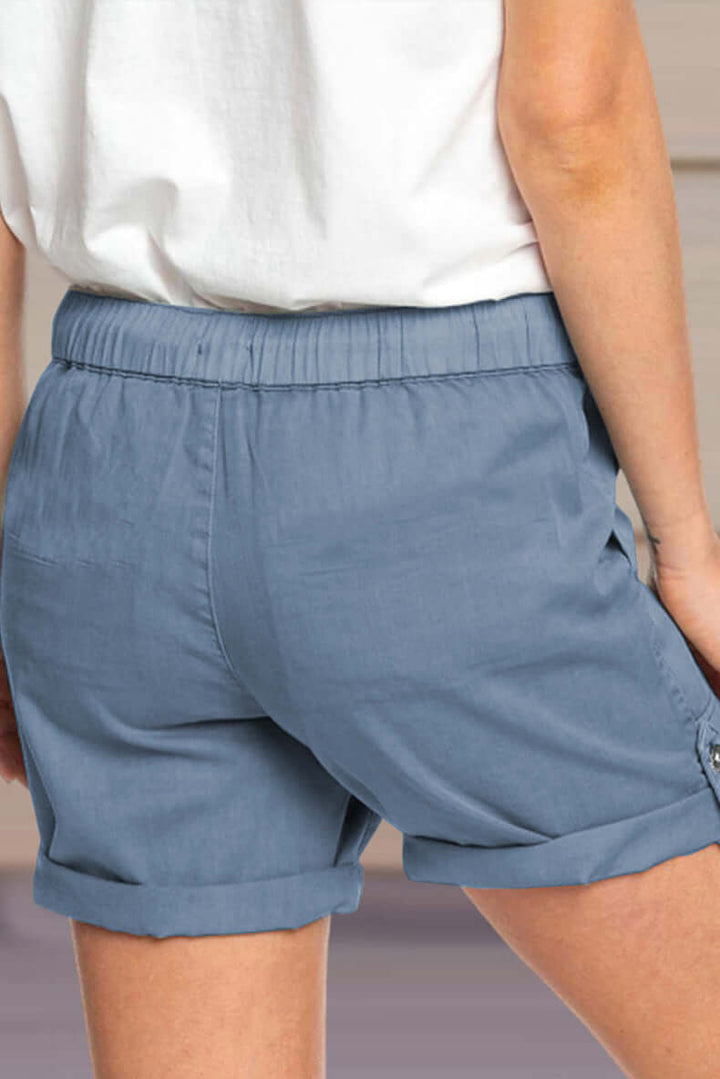 White women's relaxed fit casual shorts, drawstring closure. Essential summer bottom for style.