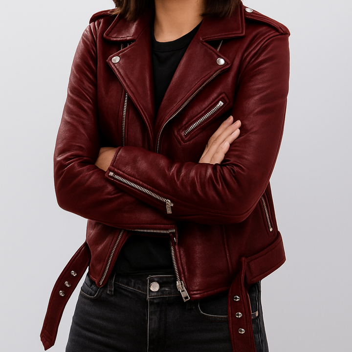 Women's black slim fit biker jacket, an edgy statement piece for autumn and winter fashion. Features zip closure.