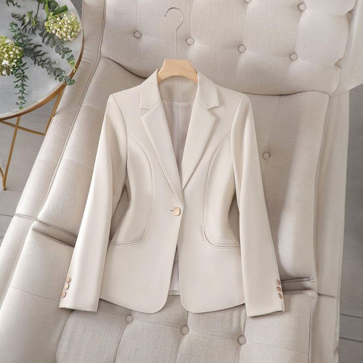 Classic women's slim-fit blazer. Lapel collar workwear jacket, great for office or professional settings.