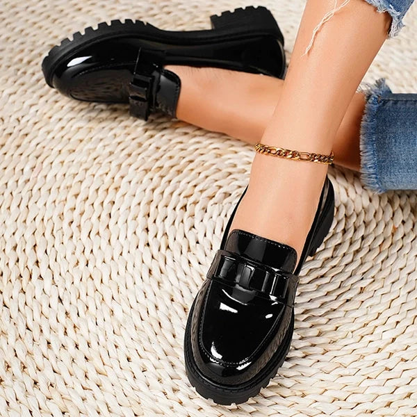 Fashionable women's slip-on platform loafers, a statement shoe with a chic bow for dressy or casual looks.