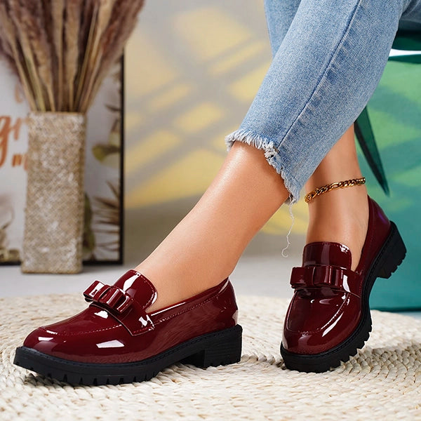 Versatile women's platform loafers with a chic bow, slip-on design, ideal for both casual and dressy occasions.