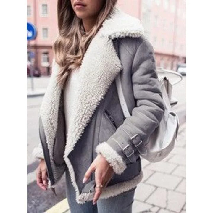 Women's trendy orange winter jacket with flattering belt & practical side pockets. Warm stylish outerwear.