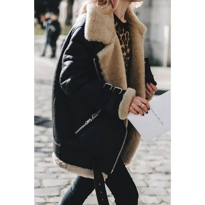 Cozy women's grey winter jacket, featuring a chic belt and functional pockets. Perfect stylish outerwear.
