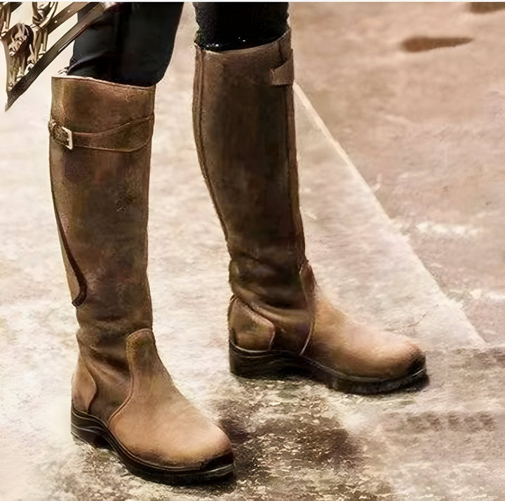 View of women's fashion knee-high boots, ideal for cold weather and wet conditions