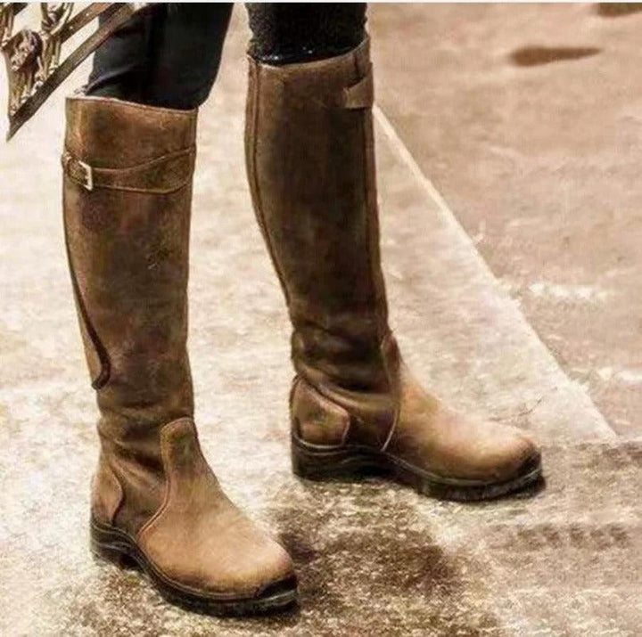Women's equestrian riding boots, waterproof & warm for winter, offering tall support & all-weather grip.