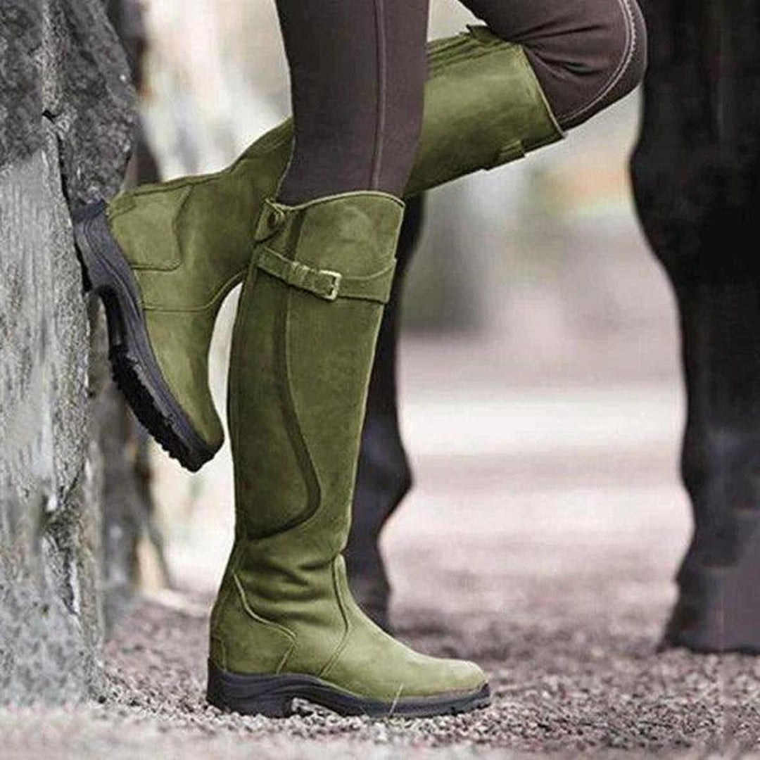 Women's waterproof winter riding boots, perfect for outdoor adventures, keeping feet dry & stylish in all weather.
