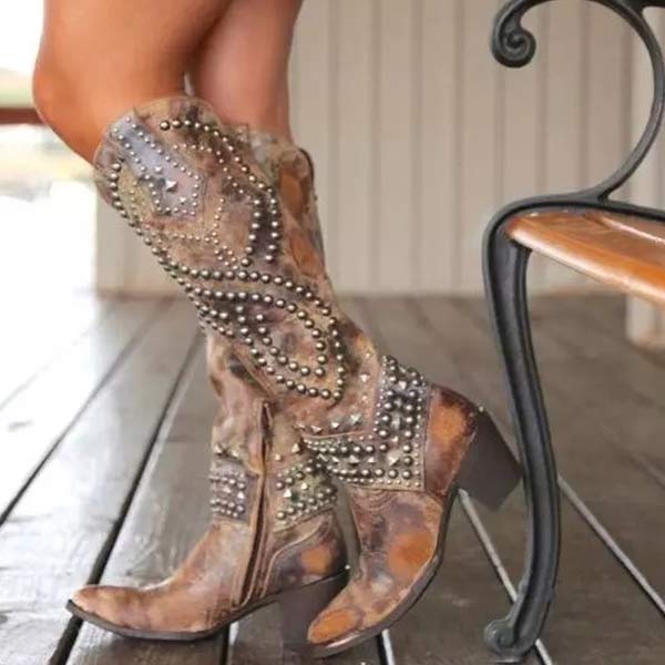 Women's black Western knee-high boots with studded detail, pointed toe, and block heel.