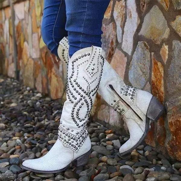 Black women's knee-high Western boots with intricate studded detailing and a pointed toe design.
