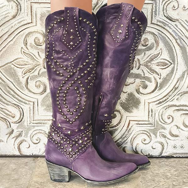 Fashionable women's footwear: knee-high Western boots with studded accents and comfortable block heel.