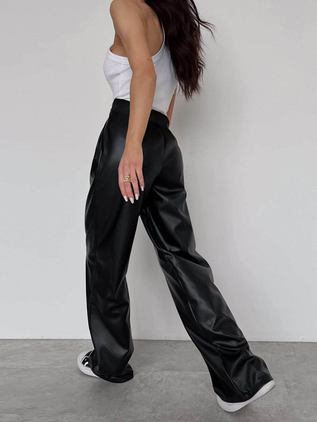 Effortless style with women's chic black wide-leg faux leather trousers. Comfortable & fashionable vegan leather pants.