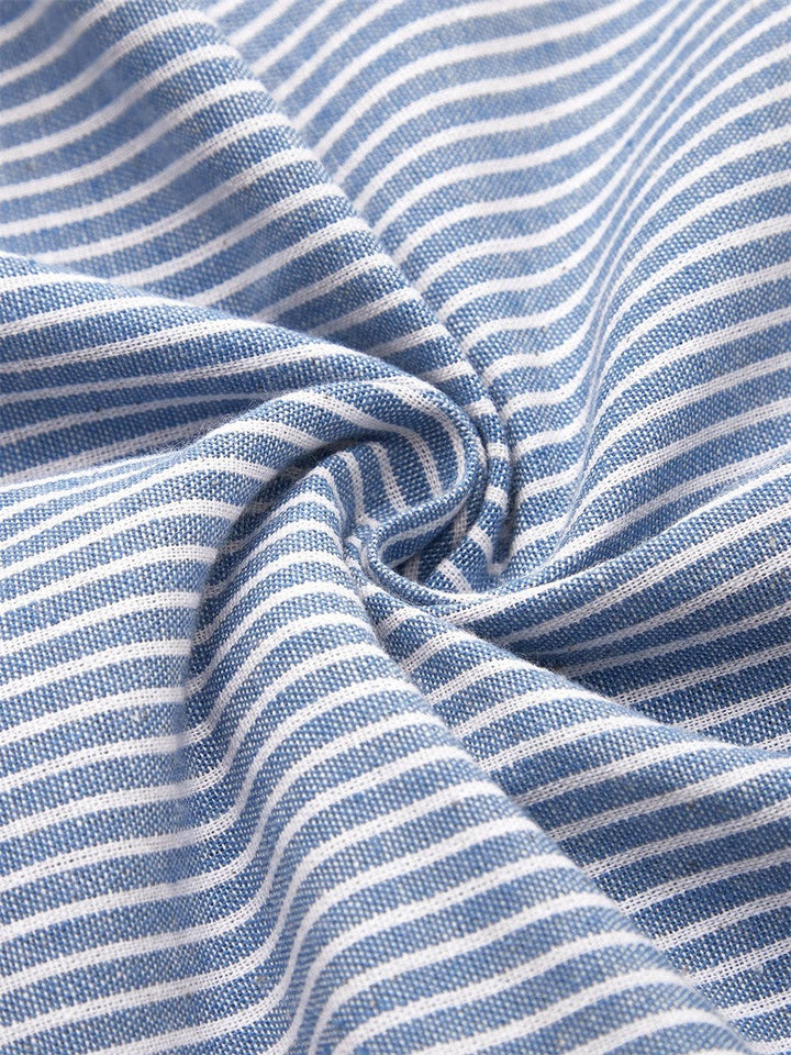 Sophisticated women's blue A-line dress with button accents, perfect for versatile elegant summer style.