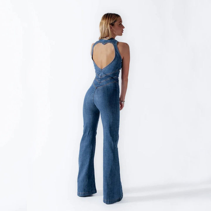 Trendy women's denim jumpsuit, blue wash, offering a flattering fit & comfortable style. Perfect casual romper.