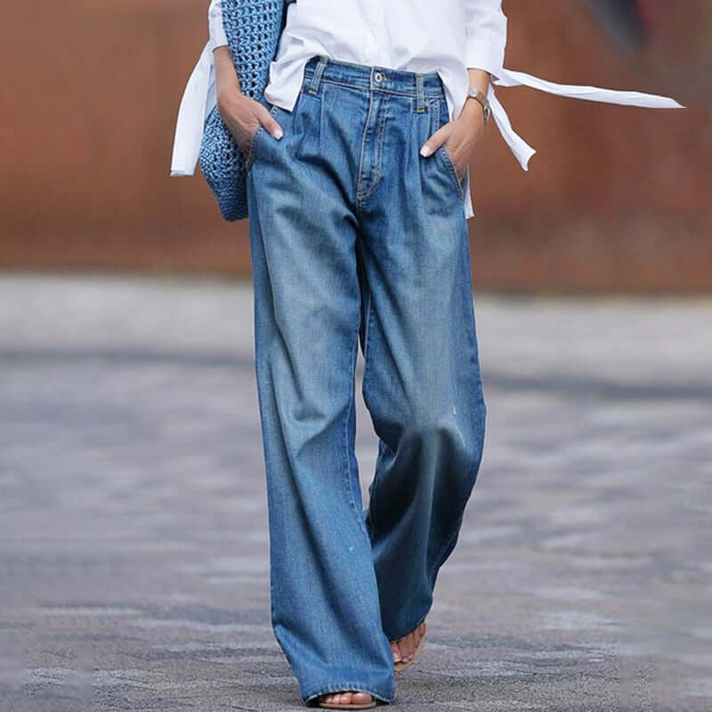 Women's blue wide-leg denim jeans, relaxed fit, perfect for comfortable everyday casual fashion & style.